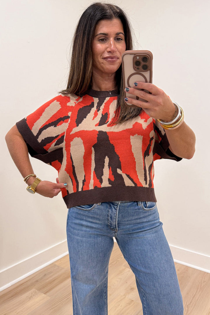 orange taupe and brown animal print crew neckline short sleeve relaxed silhouette knit sweater top