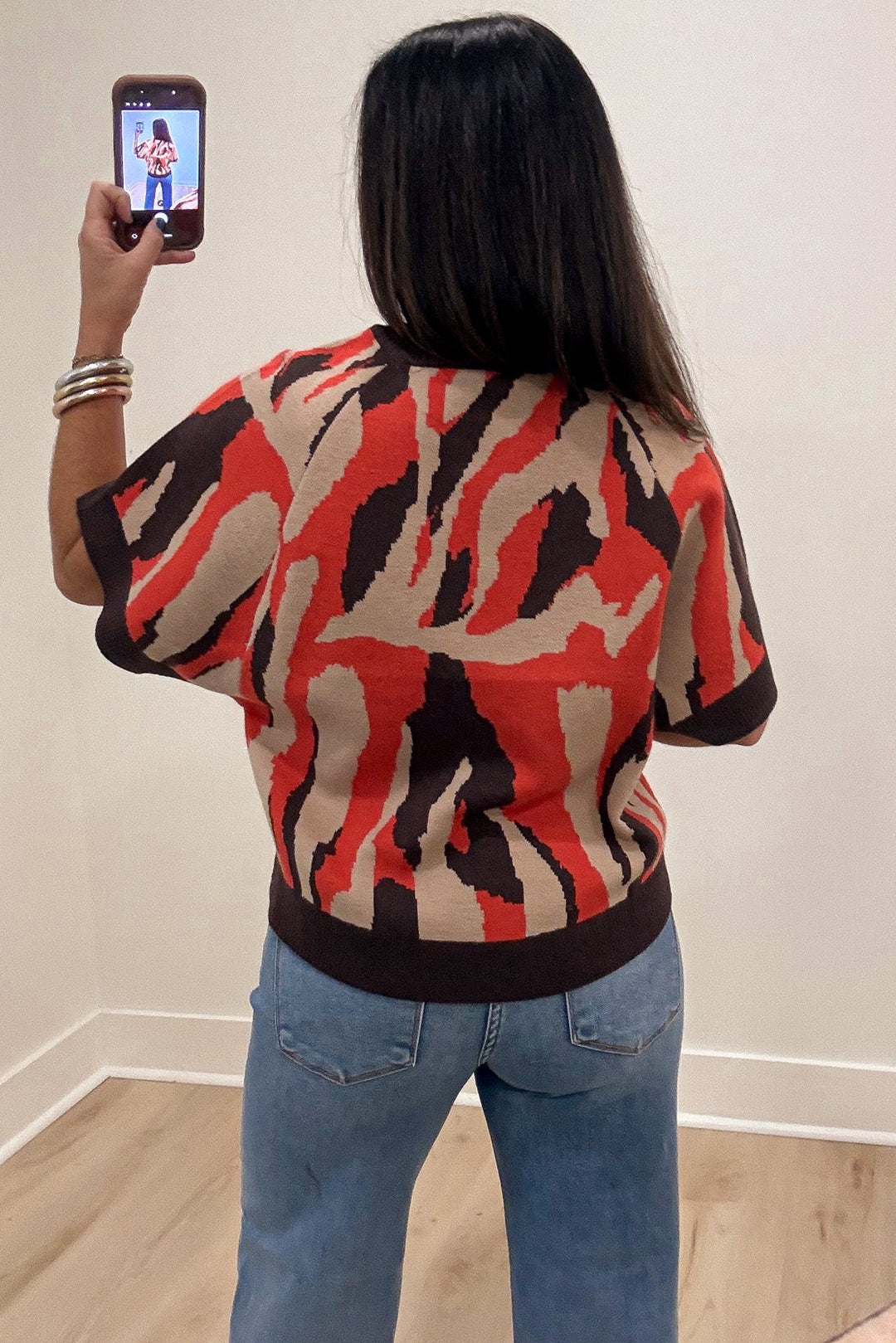 orange taupe and brown animal print crew neckline short sleeve knit sweater top with ribbed trim