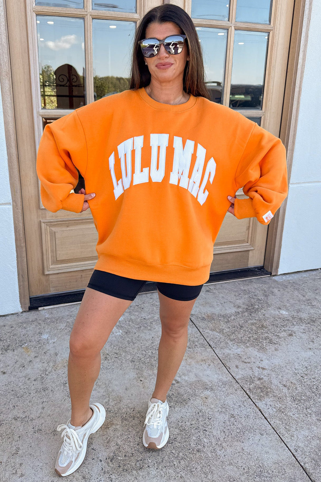 orange with white embroidered lulu mac long sleeve oversized fit sweatshirt