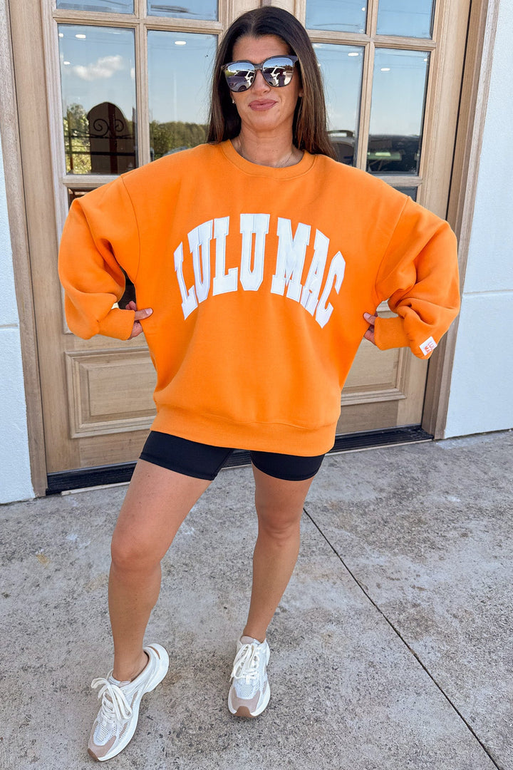orange with white embroidered lulu mac long sleeve oversized fit sweatshirt