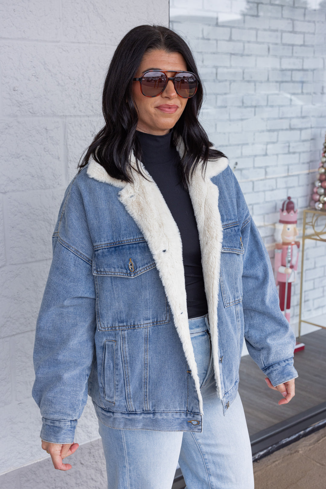 Blue denim jacket with cream faux fur lining by Wishlist showing up close, slight side view