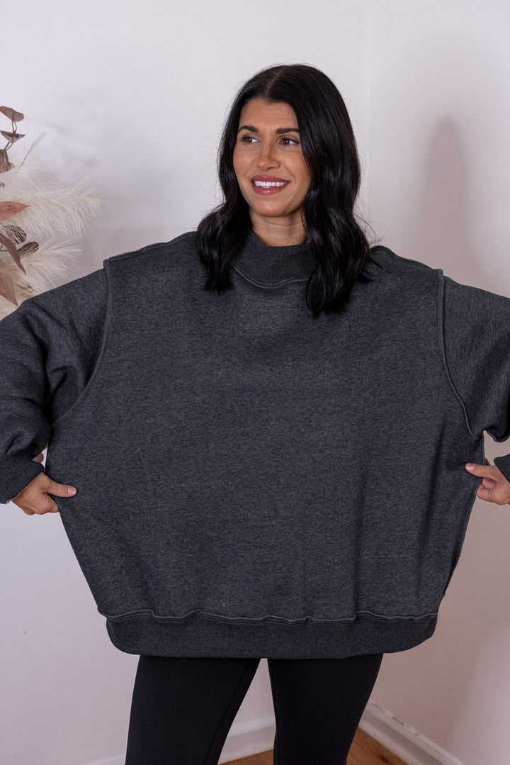 Women's charcoal reversible mock neck sweatshirt by Bucketlist showing oversized fit
