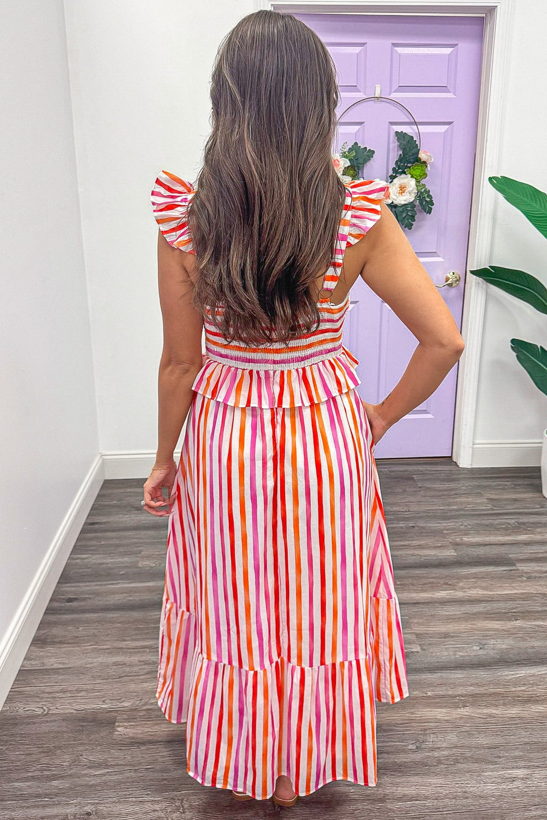 pink orange and white striped sleeveless smocked back midi dress
