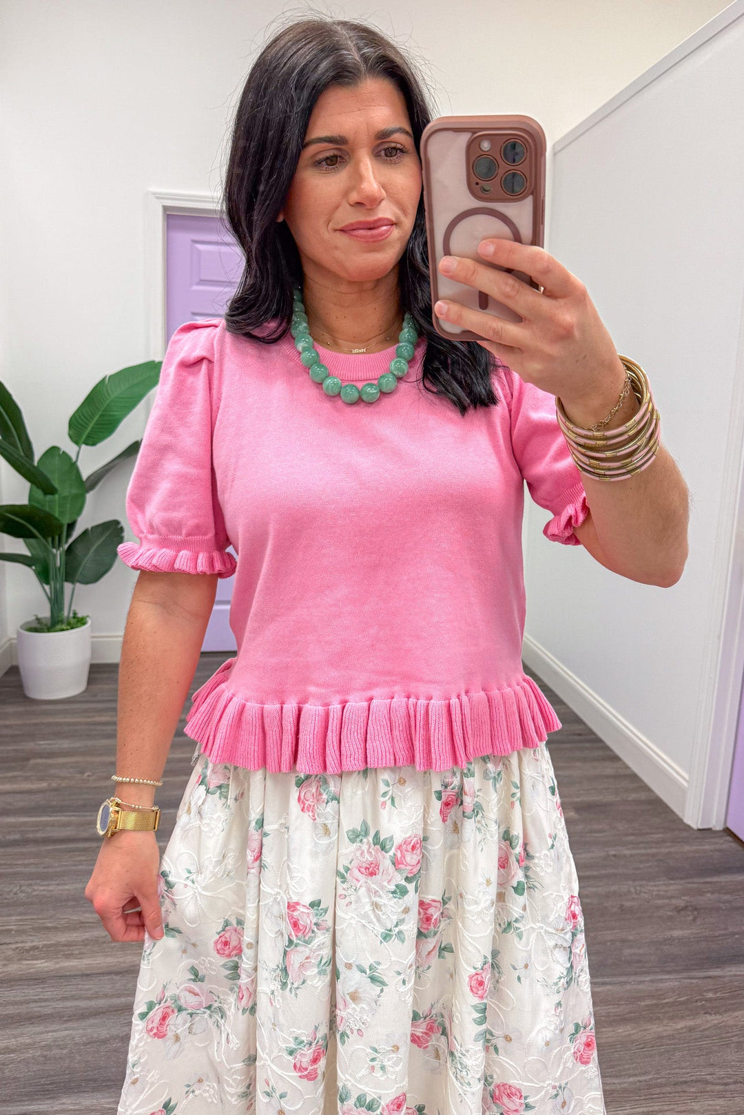 Pink ruffle pleat detail puff sleeve knit top up close