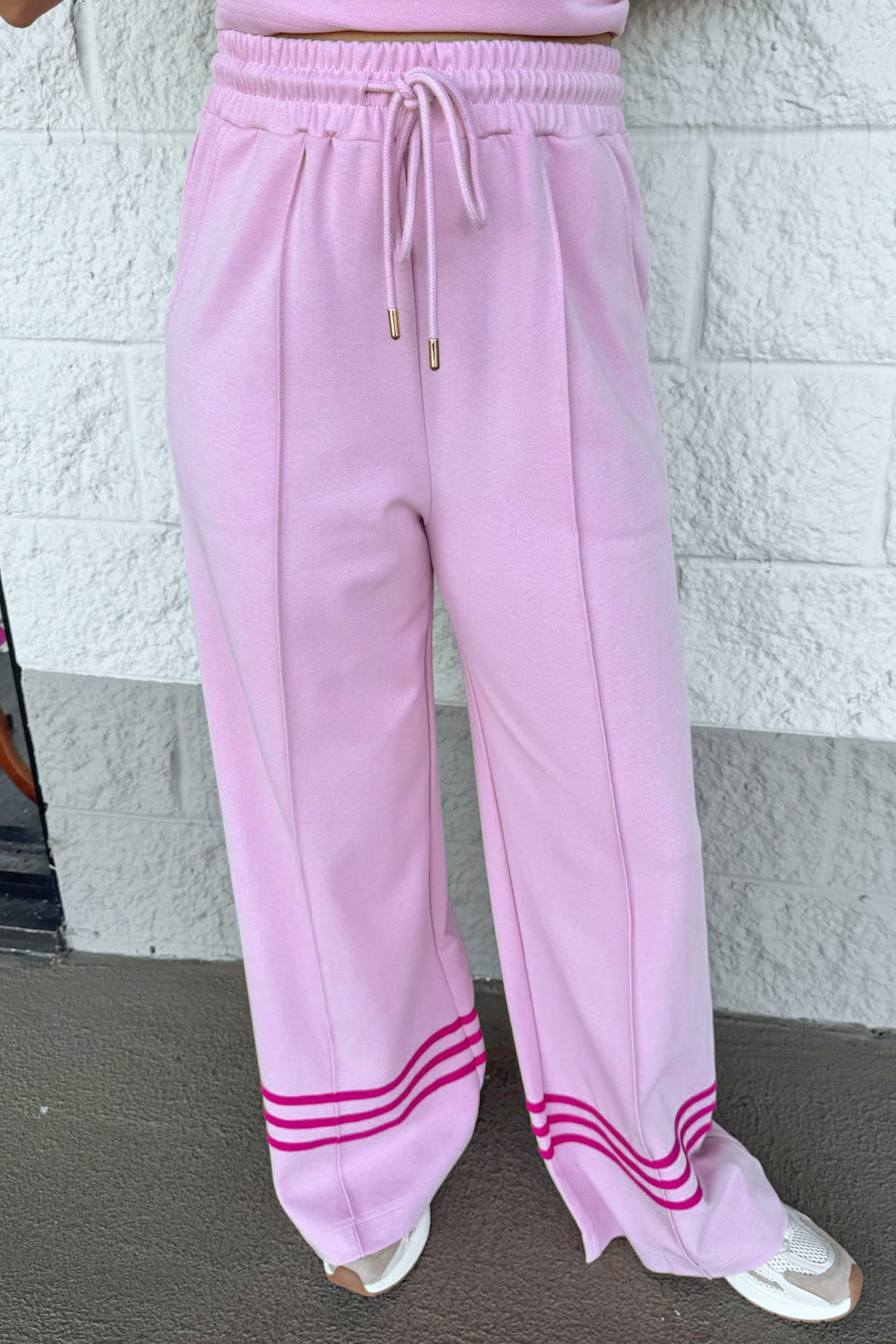 light pink with hot pink stripes at hem elastic waist wide leg knit pants with pintuck details