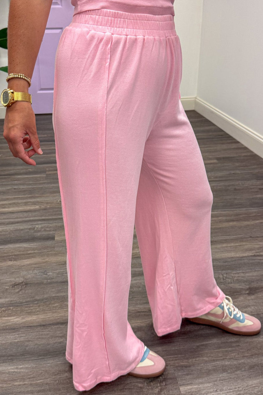 light pink tank top and reverse seam palazzo pants matching knit athleisure set