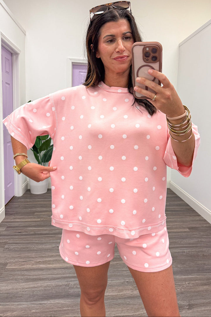 light pink with white polka dot print relaxed fit top and shorts matching knit athleisure set
