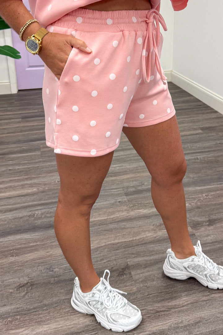 light pink with white polka dot print top and front pocket shorts matching knit athleisure set