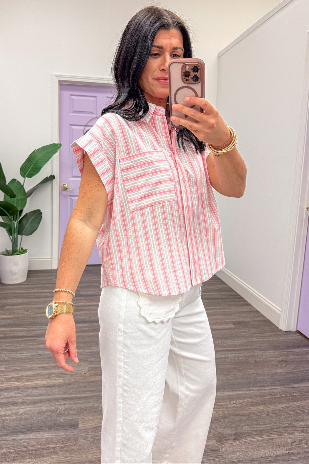 pink and white vertical striped button up cap sleeve blouse side view