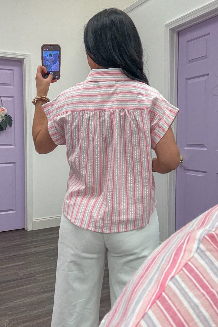 pink and white vertical striped button up cap sleeve blouse back view