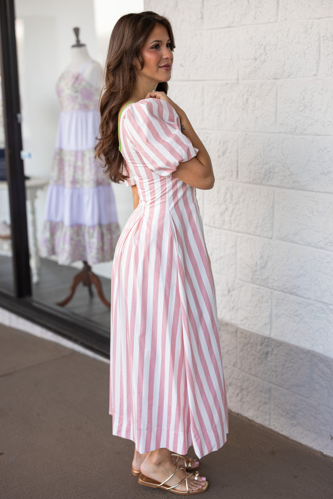 pink and white vertical striped midi dress with green piping trim side pockets