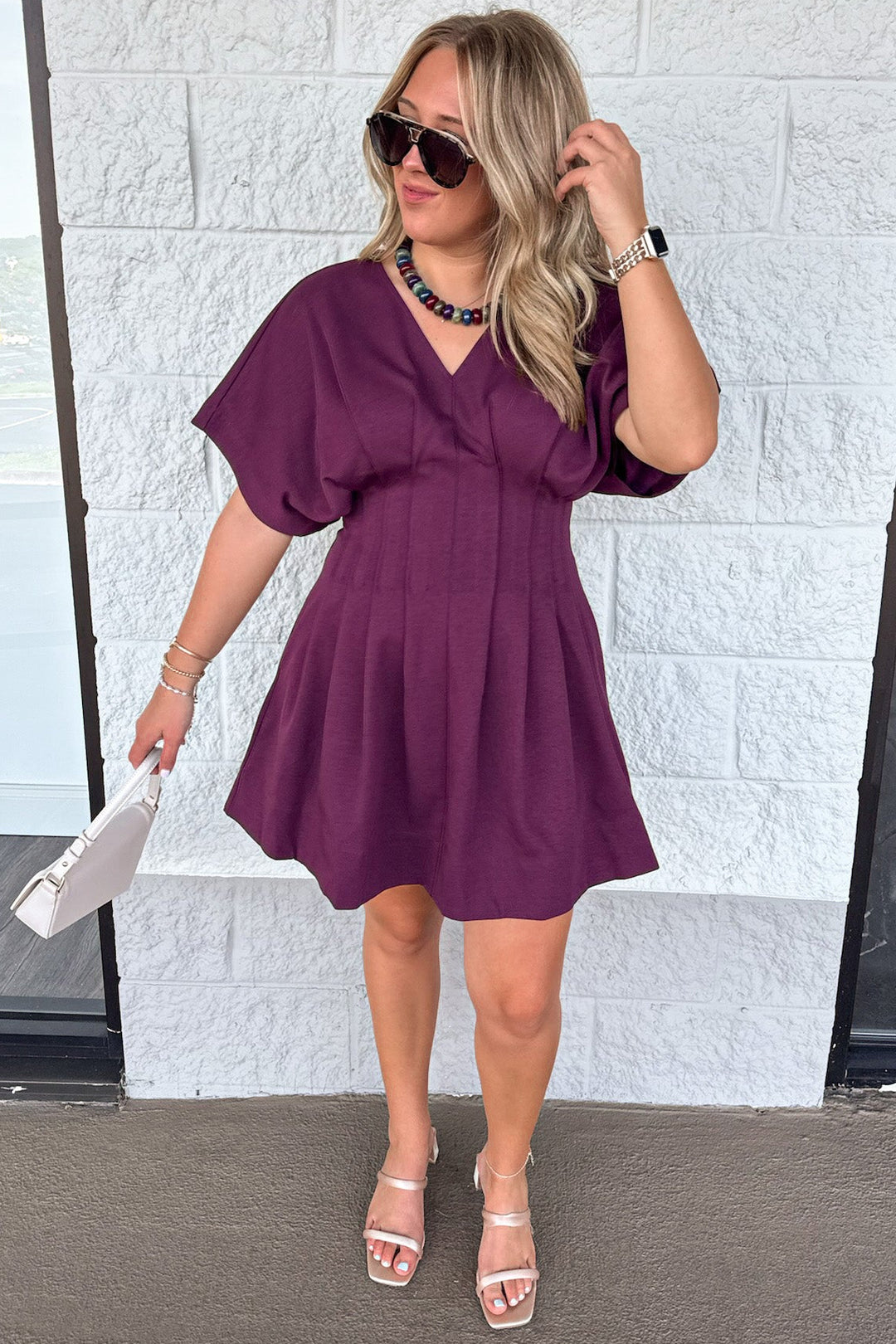 solid plum short dolman sleeve v neckline pleated short dress with pintuck details