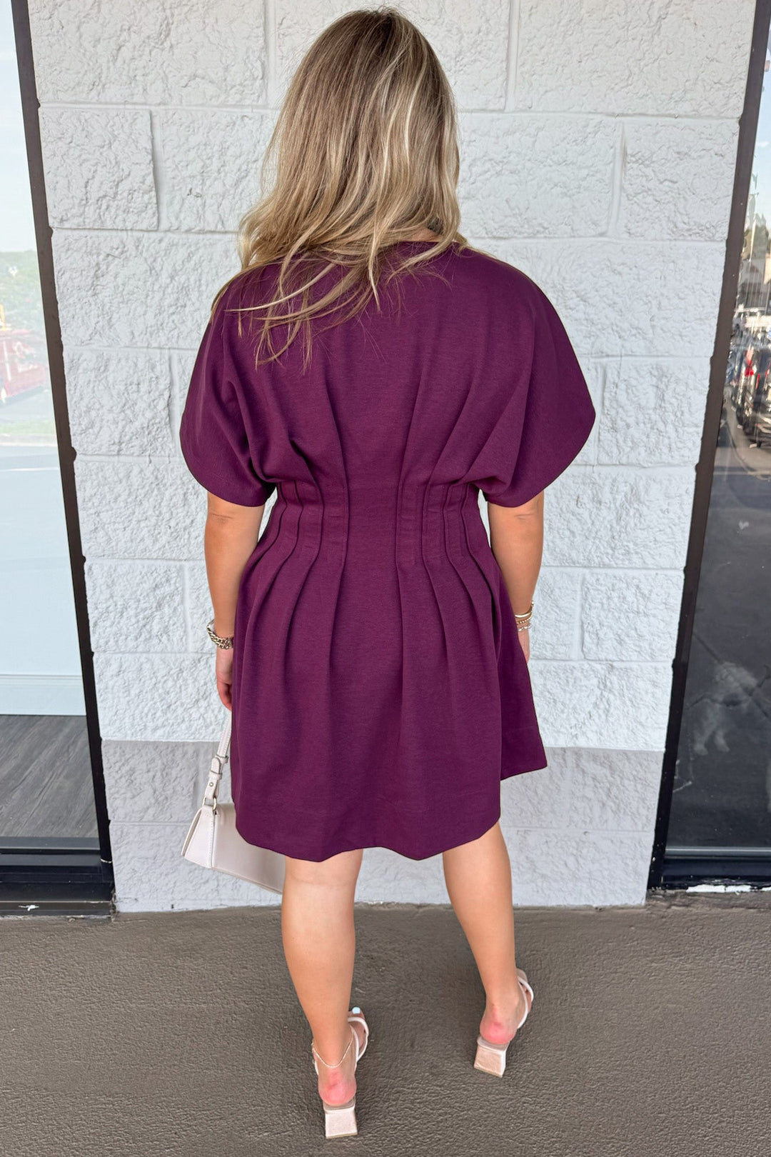 solid plum dolman sleeve v-neck pleated short dress with pintuck details