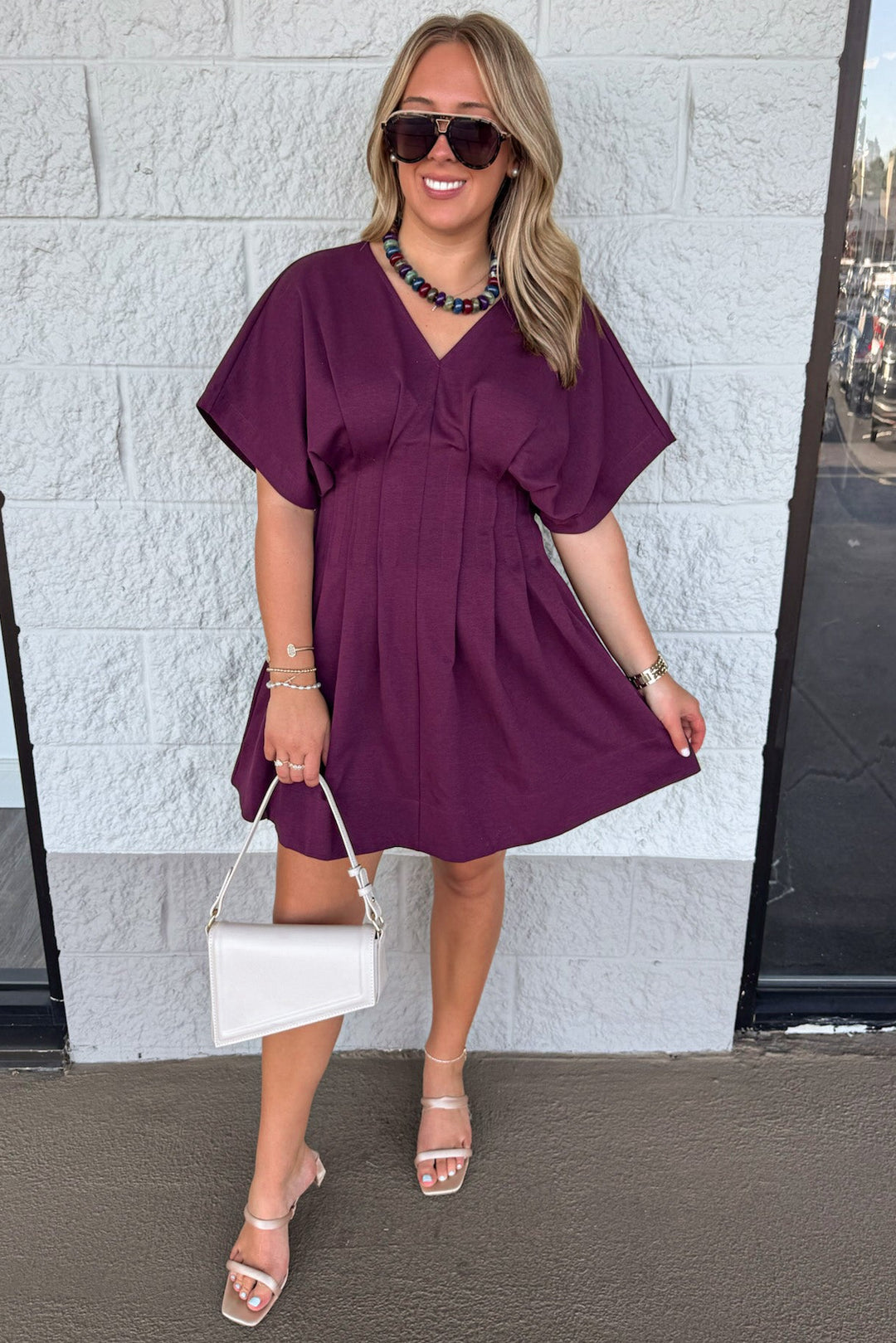 solid plum dolman sleeve v neckline pleated short dress with pintuck details