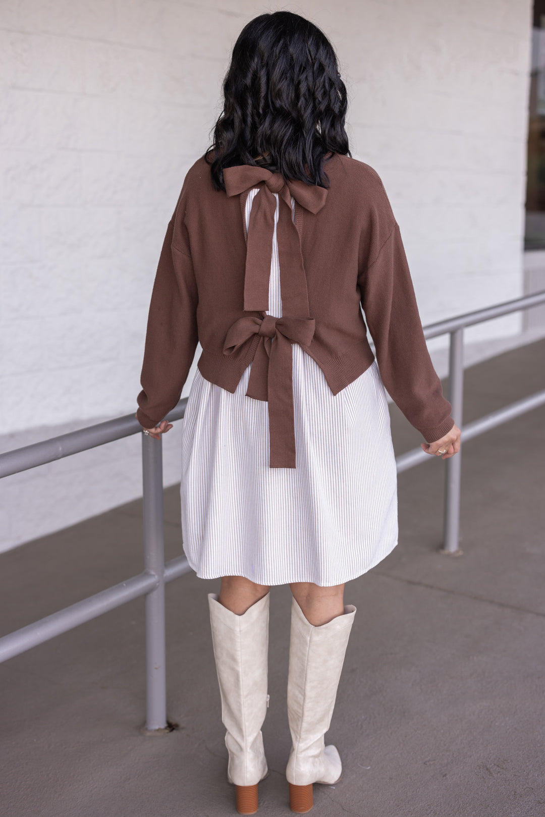 Women's taupe and cream dress with attached brown knit cropped cardigan by In February showing full back view