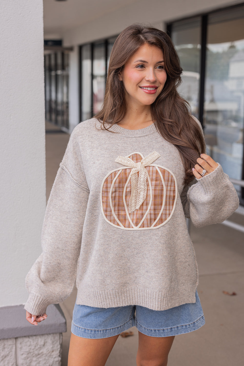 Women's grey knit sweater with a brown plaid pumpkin and cream lace detail on front by Fantastic Fawn showing up close front view