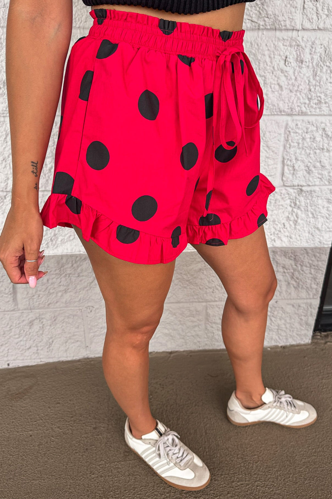 red with black polka dot print ruffled hem elastic waist cotton shorts with front pockets