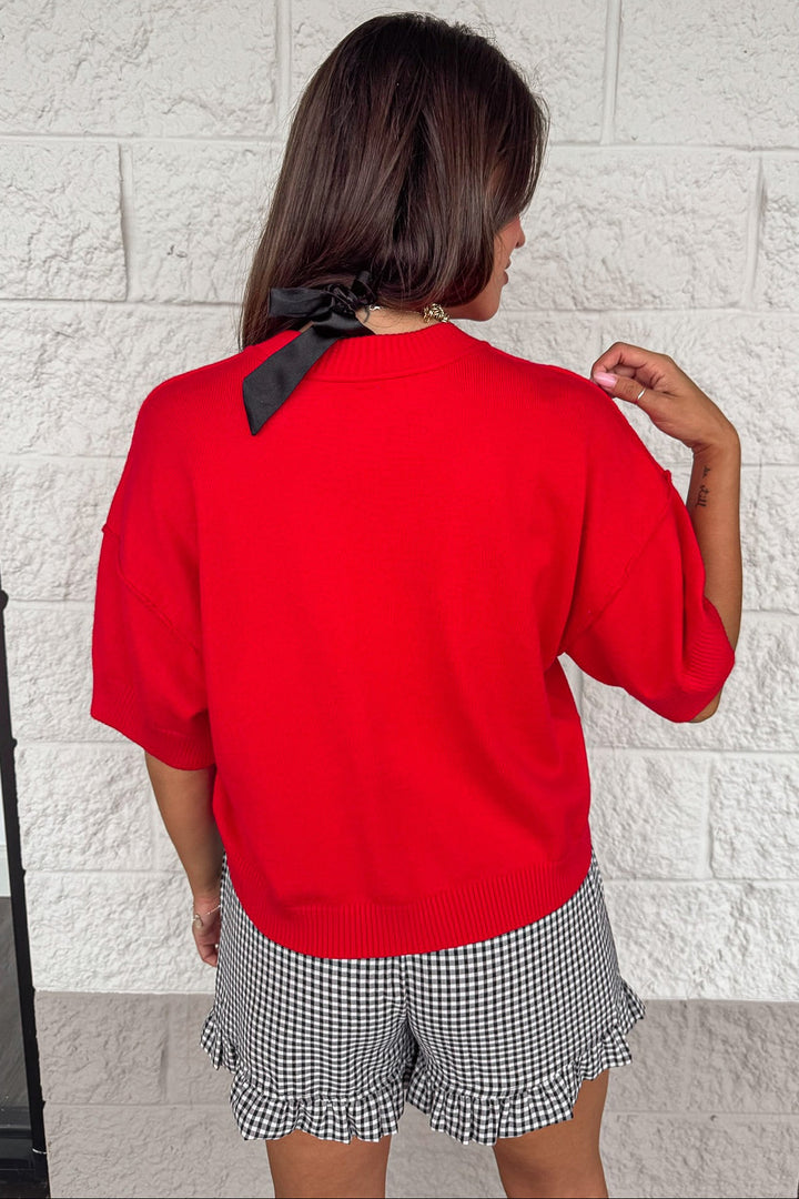 solid red crew neckline button front ribbed hem semi-cropped knit cardigan top
