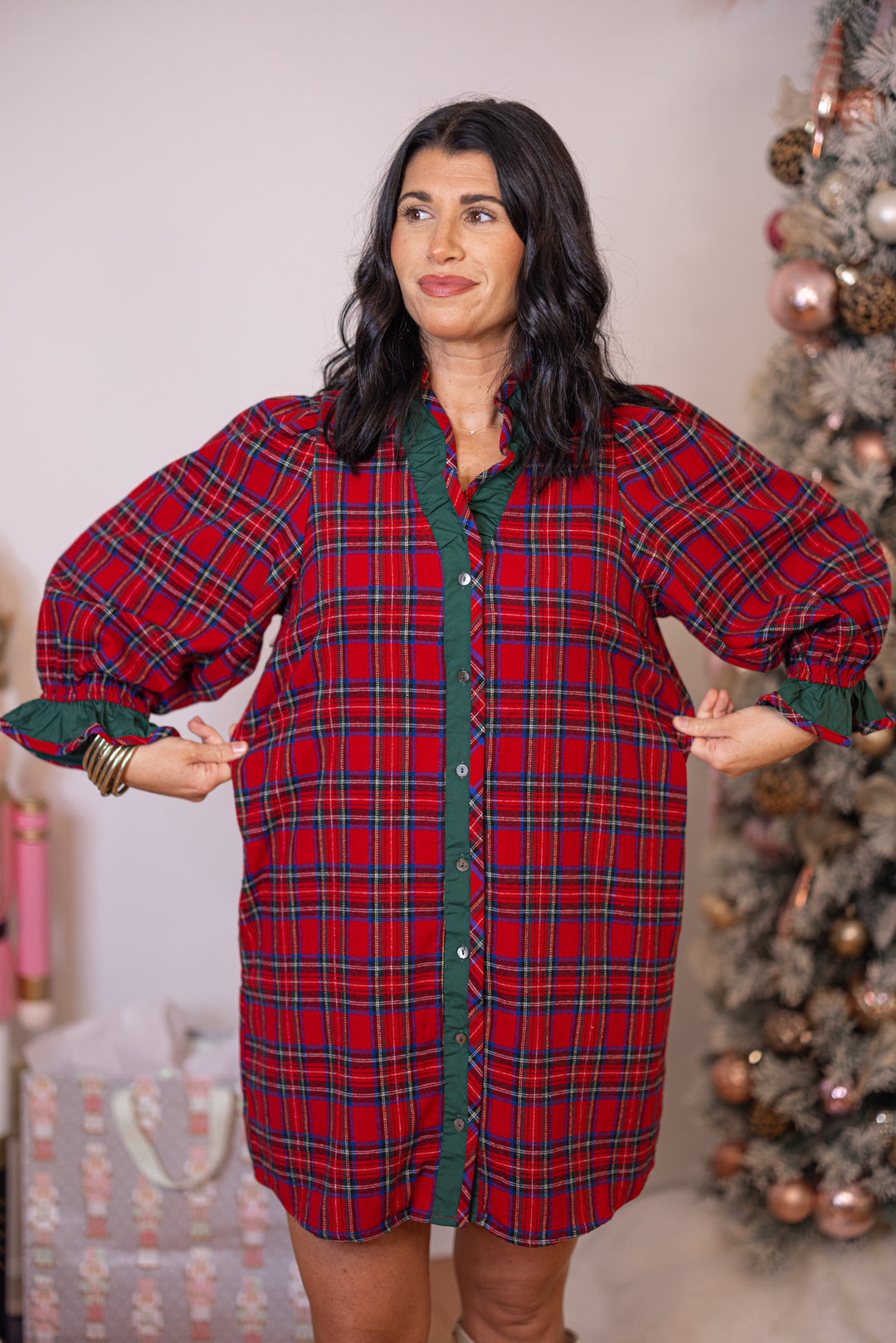 Women's red and green plaid flannel button front dress with ruffle details by Entro showing true to size fit