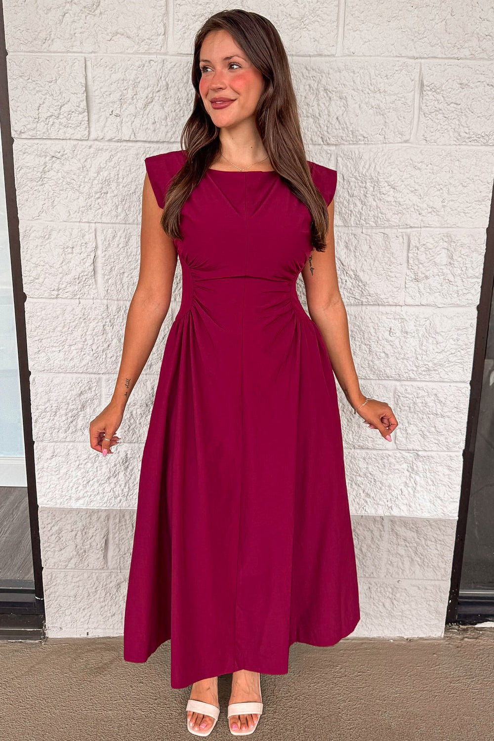 solid wine red cinched waist sleeveless midi dress with fitted bodice