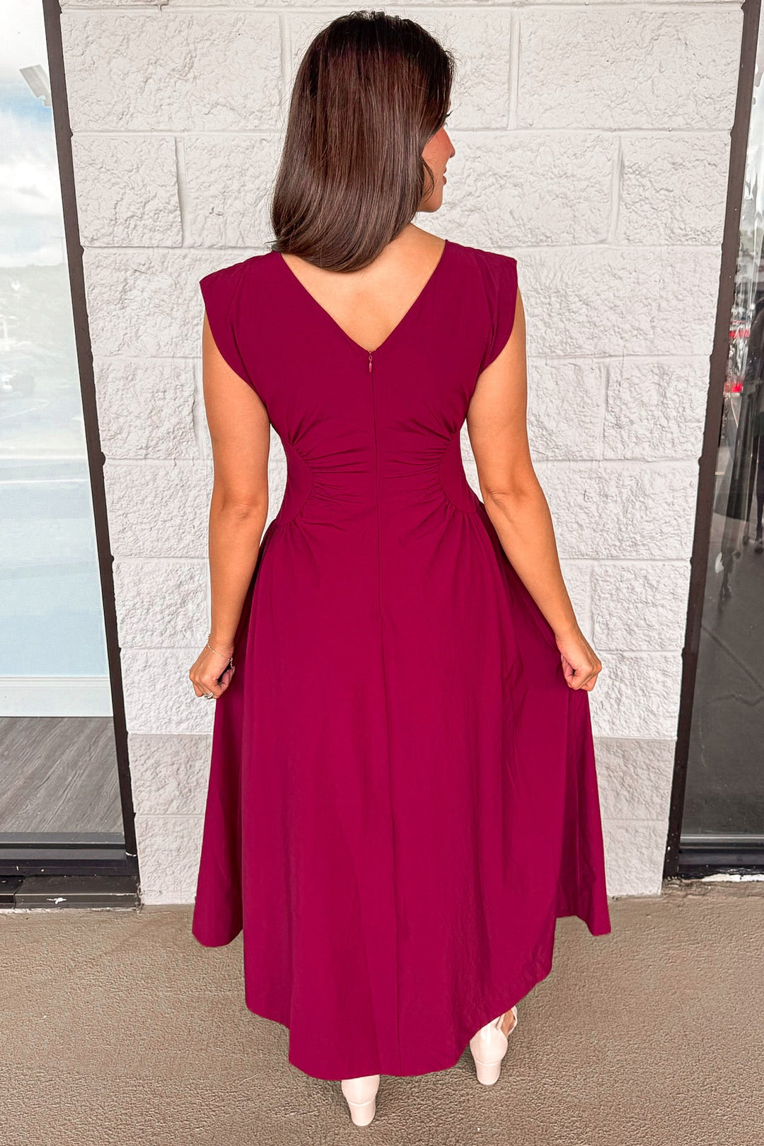 solid wine red cinched waist sleeveless midi dress with hook and eye zipper closure