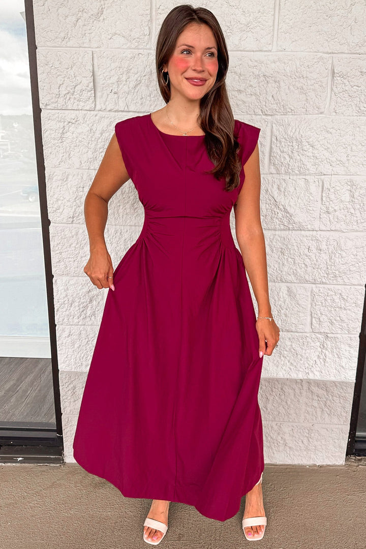 solid wine red cinched waist sleeveless midi dress with flowy skirt