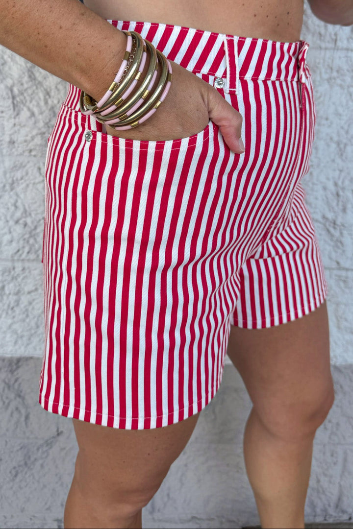 red and cream vertical striped print five pocket style twill shorts