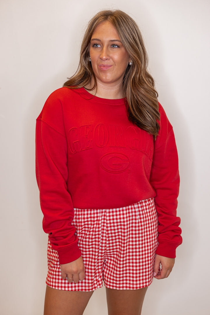 Women's red terry knit sweatshirt with embossed 'Georgia' in center by Gameday Social