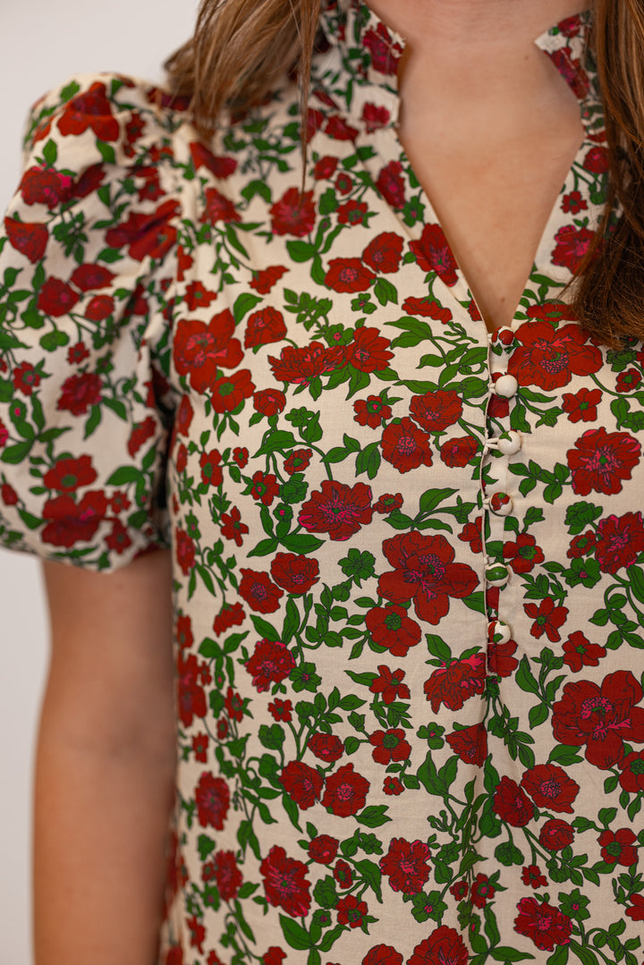 Women's ecru midi dress with burgundy, pink and green floral print by Entro showing button front bodice and v neck line detail