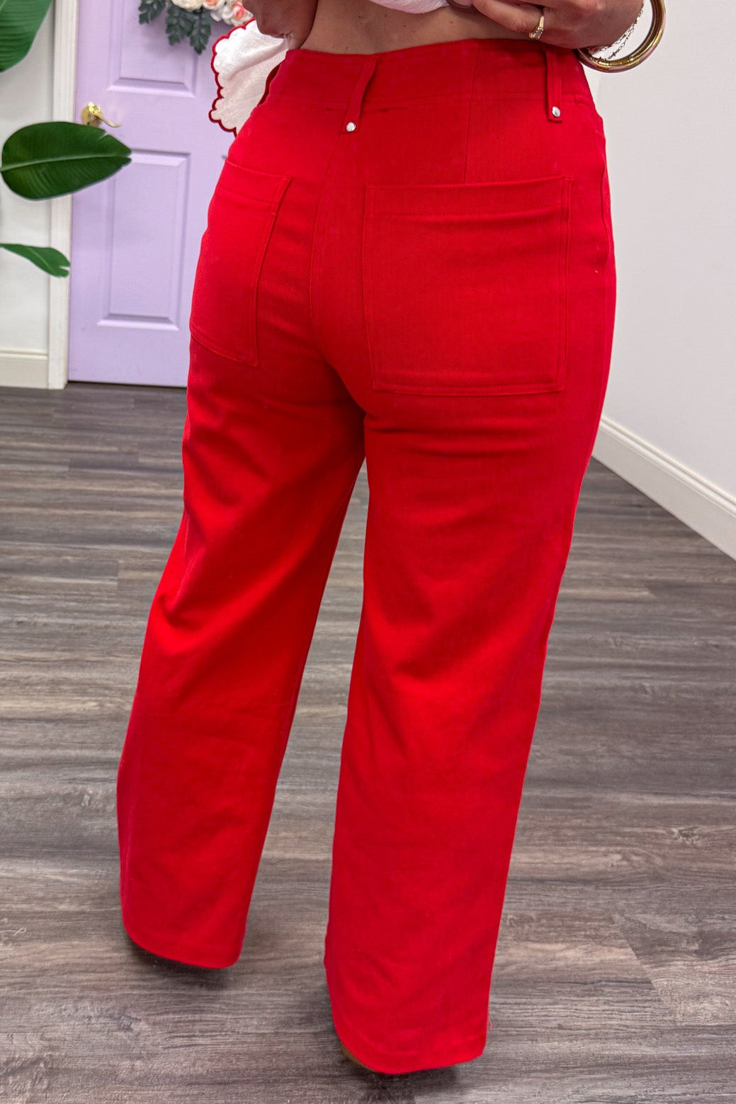 red high rise wide leg denim pants with pintuck seam detail and back pockets
