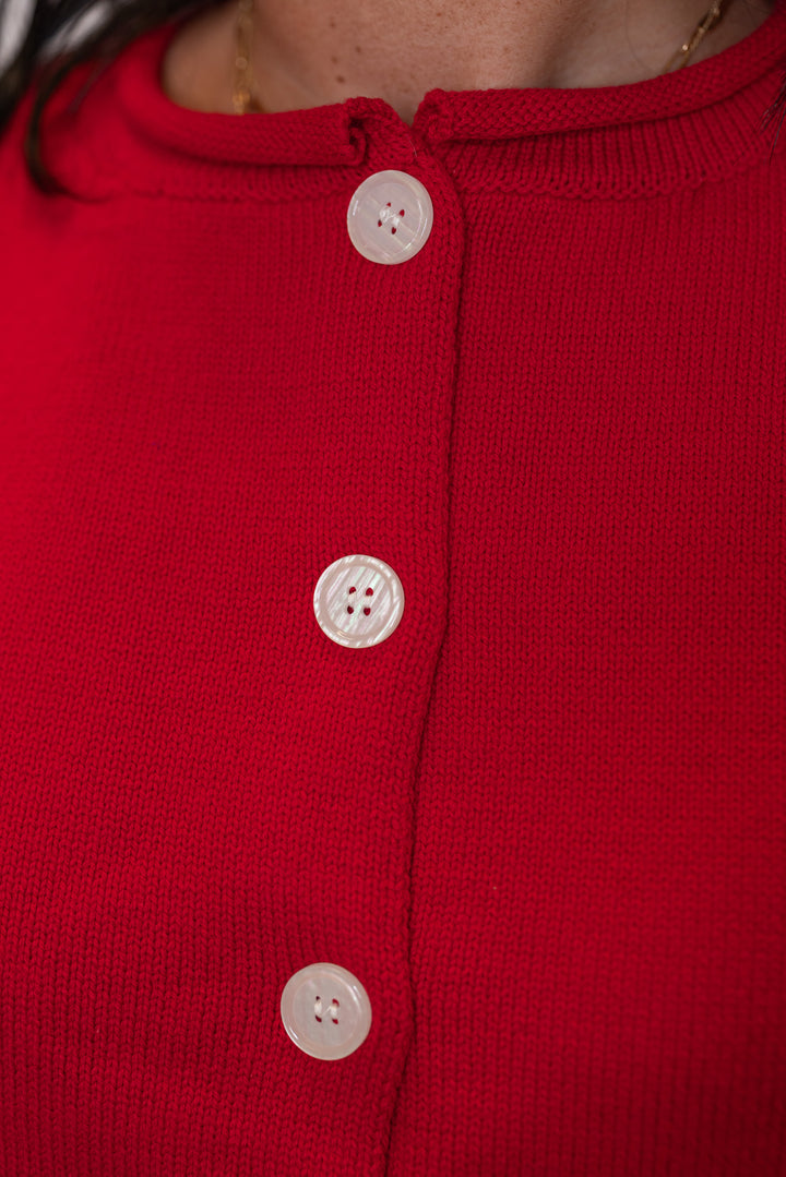 Red knit button front sleeveless sweater vest by Wishlist showing button front closure