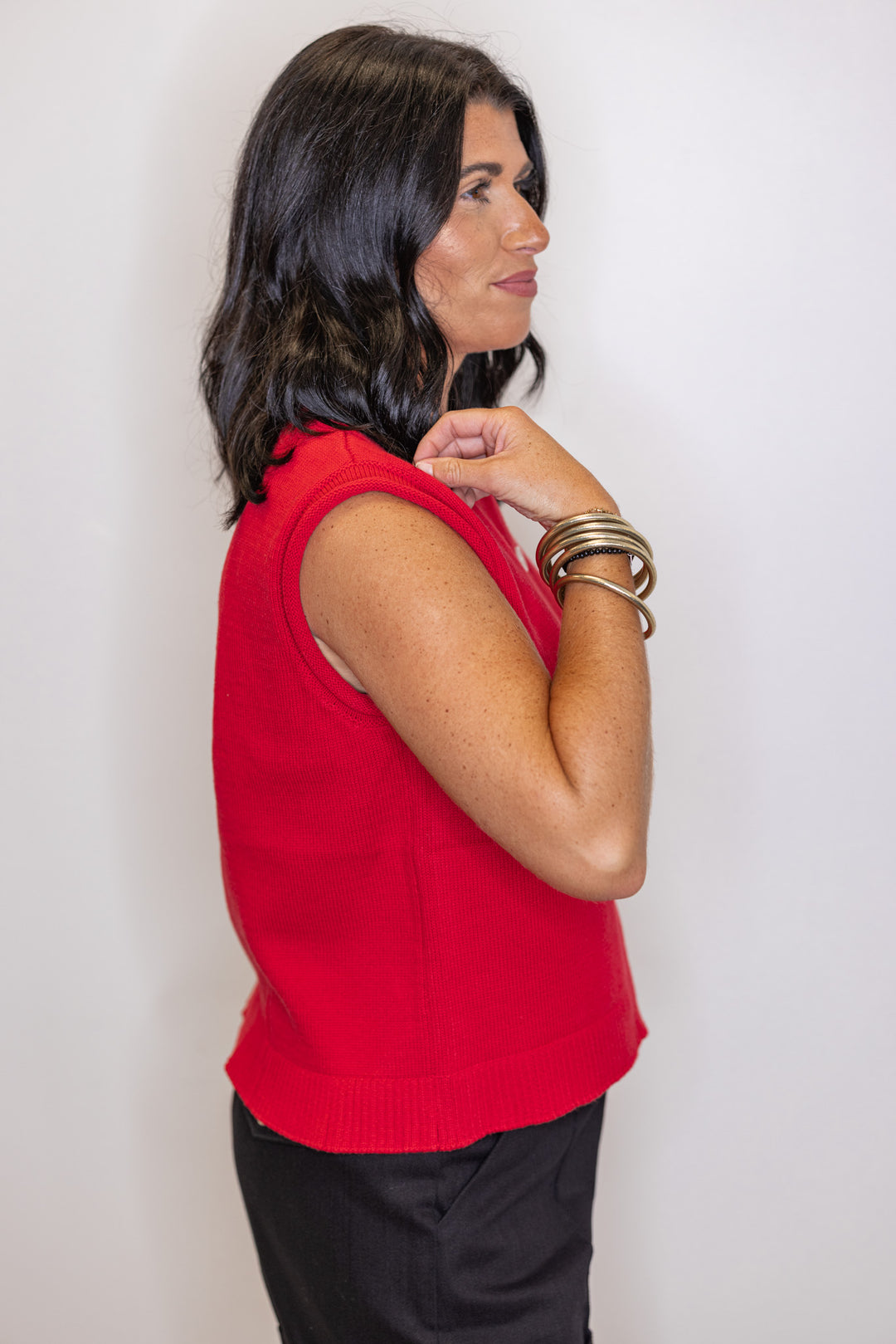 Red knit button front sleeveless sweater vest by Wishlist showing up close side view