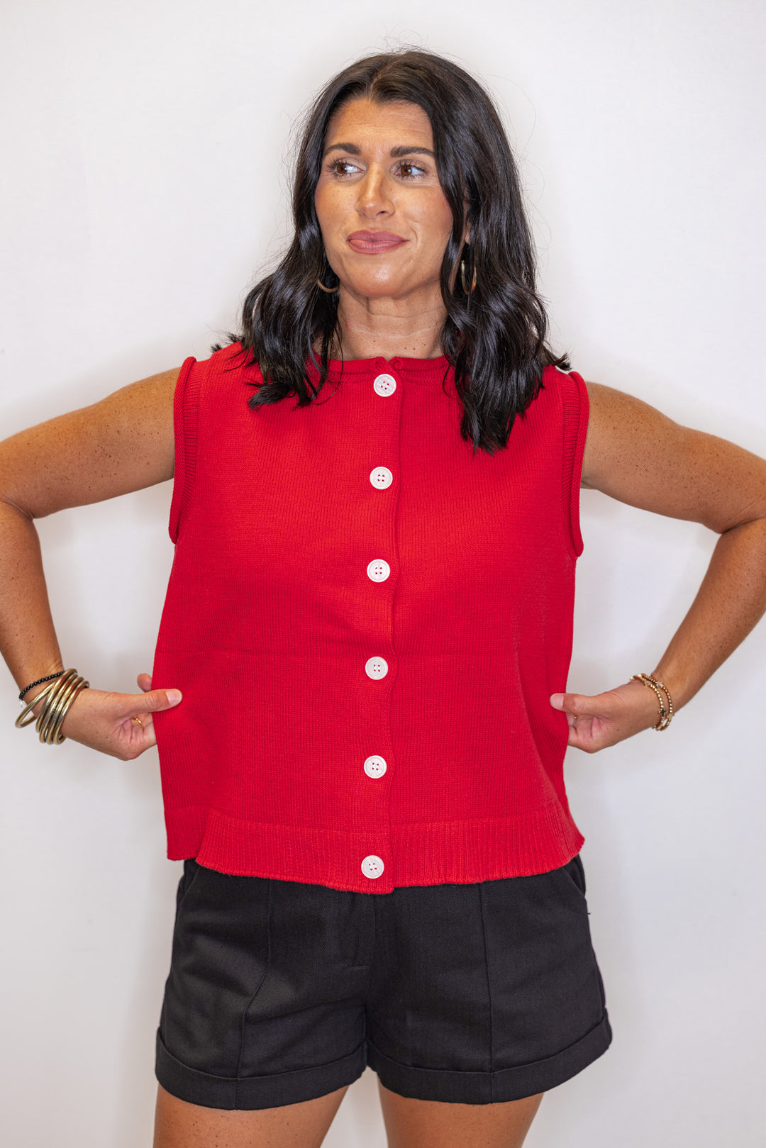 Red knit button front sleeveless sweater vest by Wishlist showing relaxed silouhette