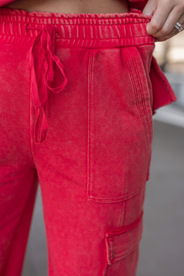 Women's washed red french terry knit wide leg cargo pants by ee:some showing elastic waistband