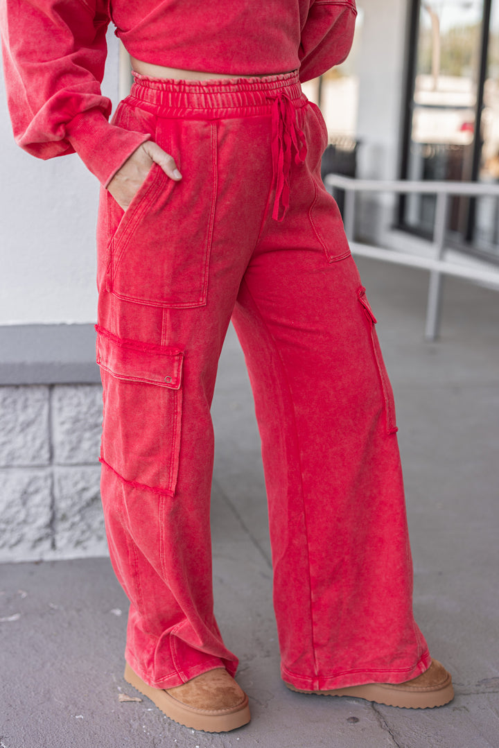 Women's washed red french terry knit wide leg cargo pants by ee:some showing slight side view