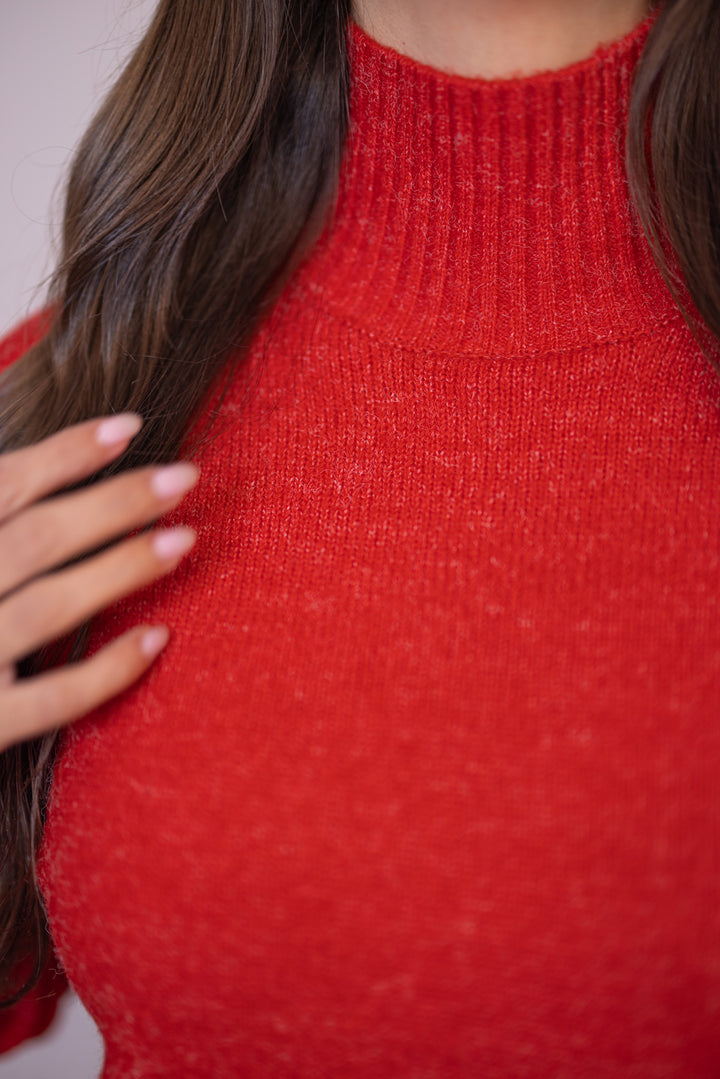 Women's red mock neck sweater dress by Heyson showing ribbed mock neckline