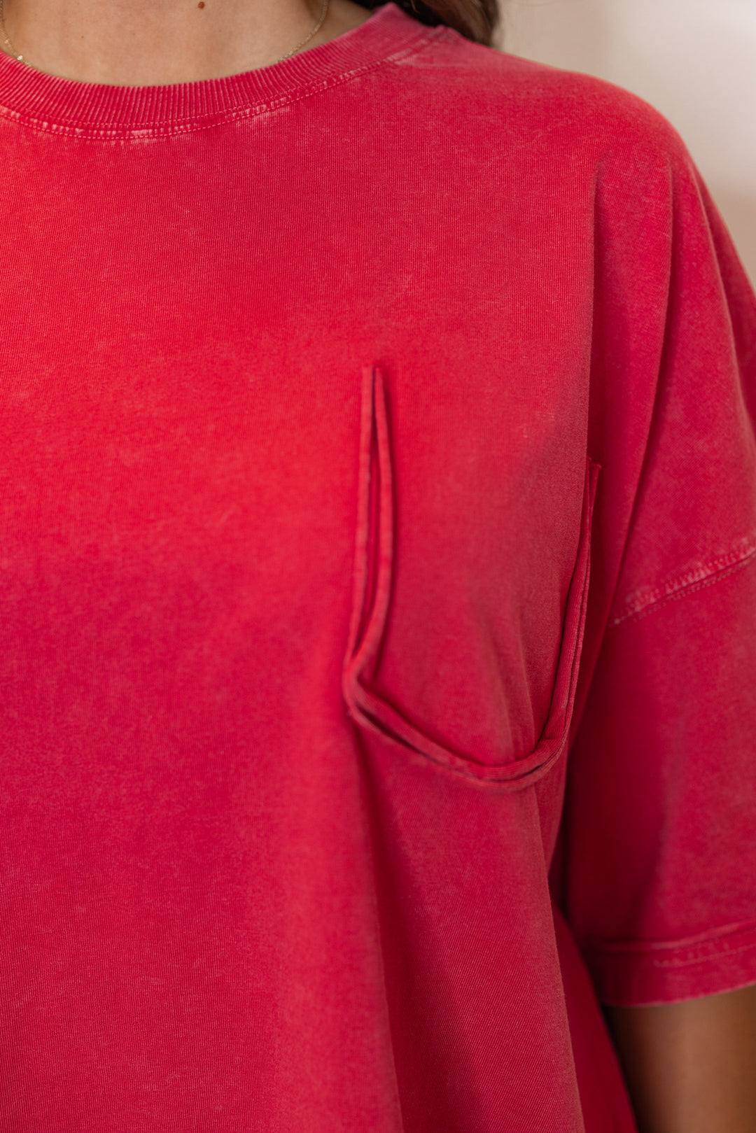 Women's mineral washed red oversized tee by Easel showing missing front chest pocket