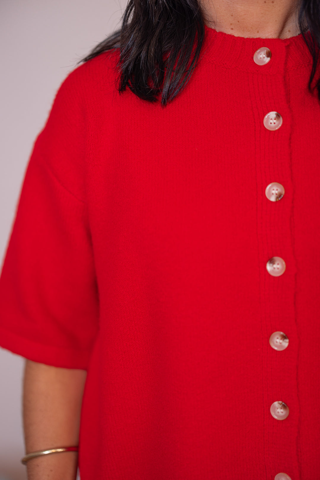 Women's red brushed sweater knit button front top by Wishlist showing button details