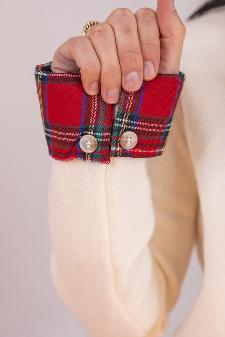 Women's cream button front sweater knit cardigan with contrasting red plaid trim by Entro showing red plaid details