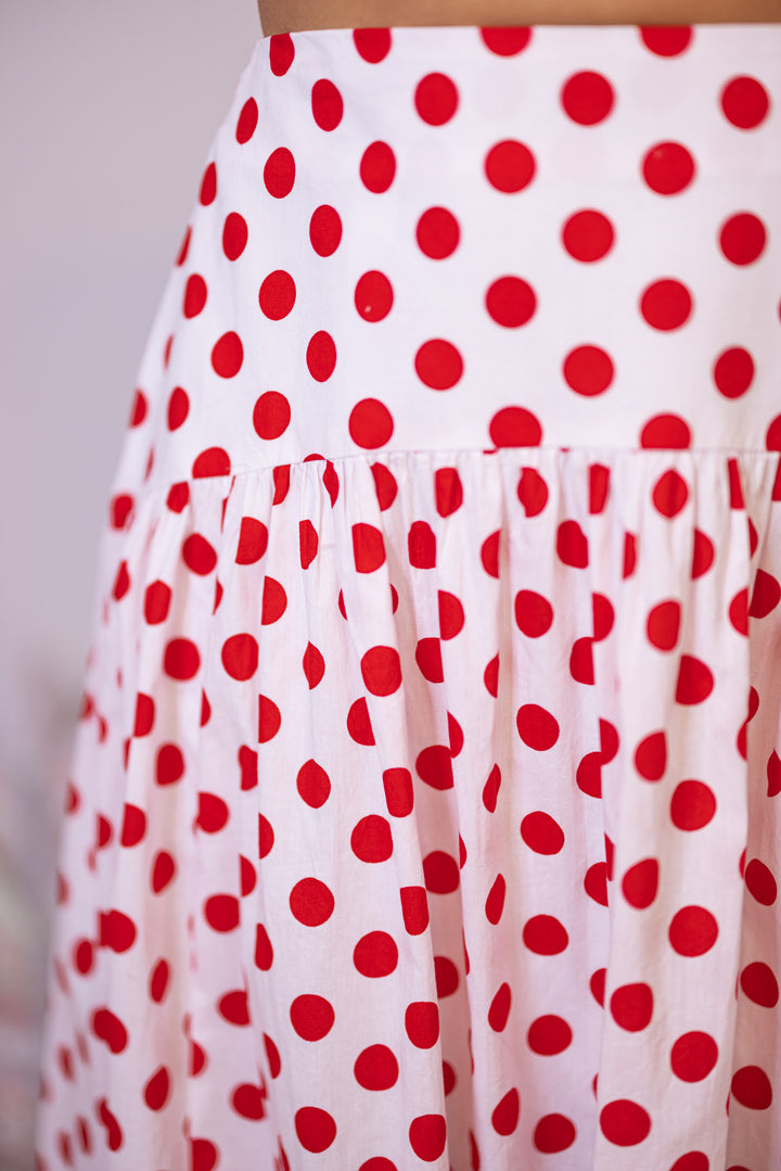 Red Polka Dot Maxi Skirt by Day + Moon showing curved yoke design