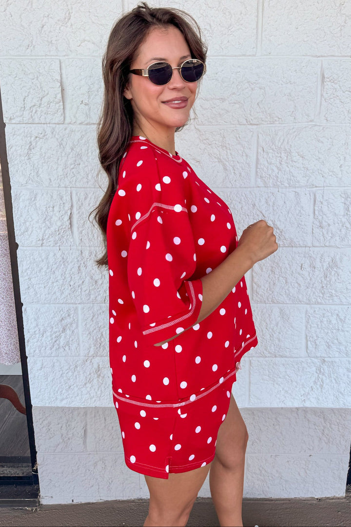 red with white polka dot print and reverse seams top and shorts matching knit athleisure set