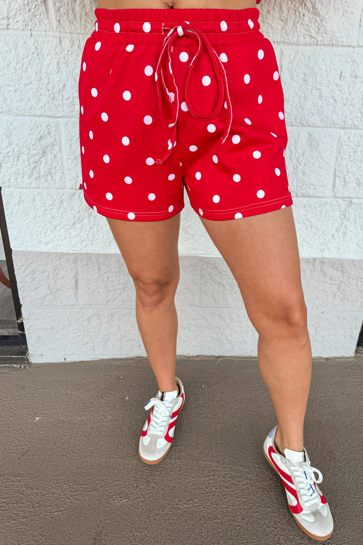 red with white polka dot print top and drawstring elastic waist shorts matching knit athleisure set