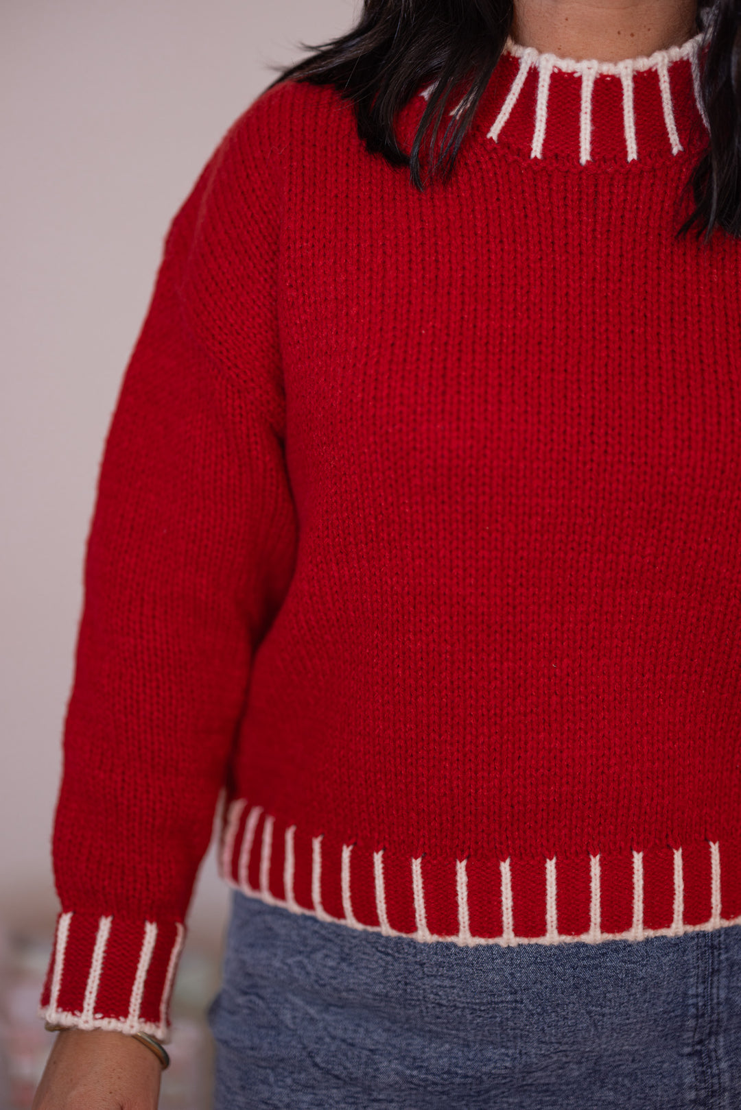 Women's red sweater knit boxy top with cream stitching trim details by So Me showing up close view