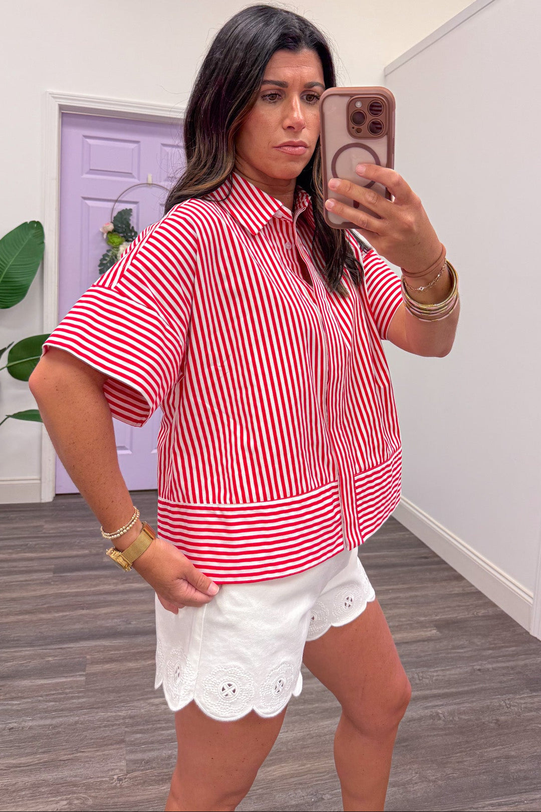 red and white striped hidden button front collared crew neckline top