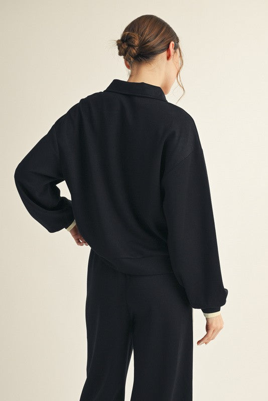 Women's black scuba knit quarter zip pullover with contrasting ribbed colorblock trim by Jodifl showing up close back view