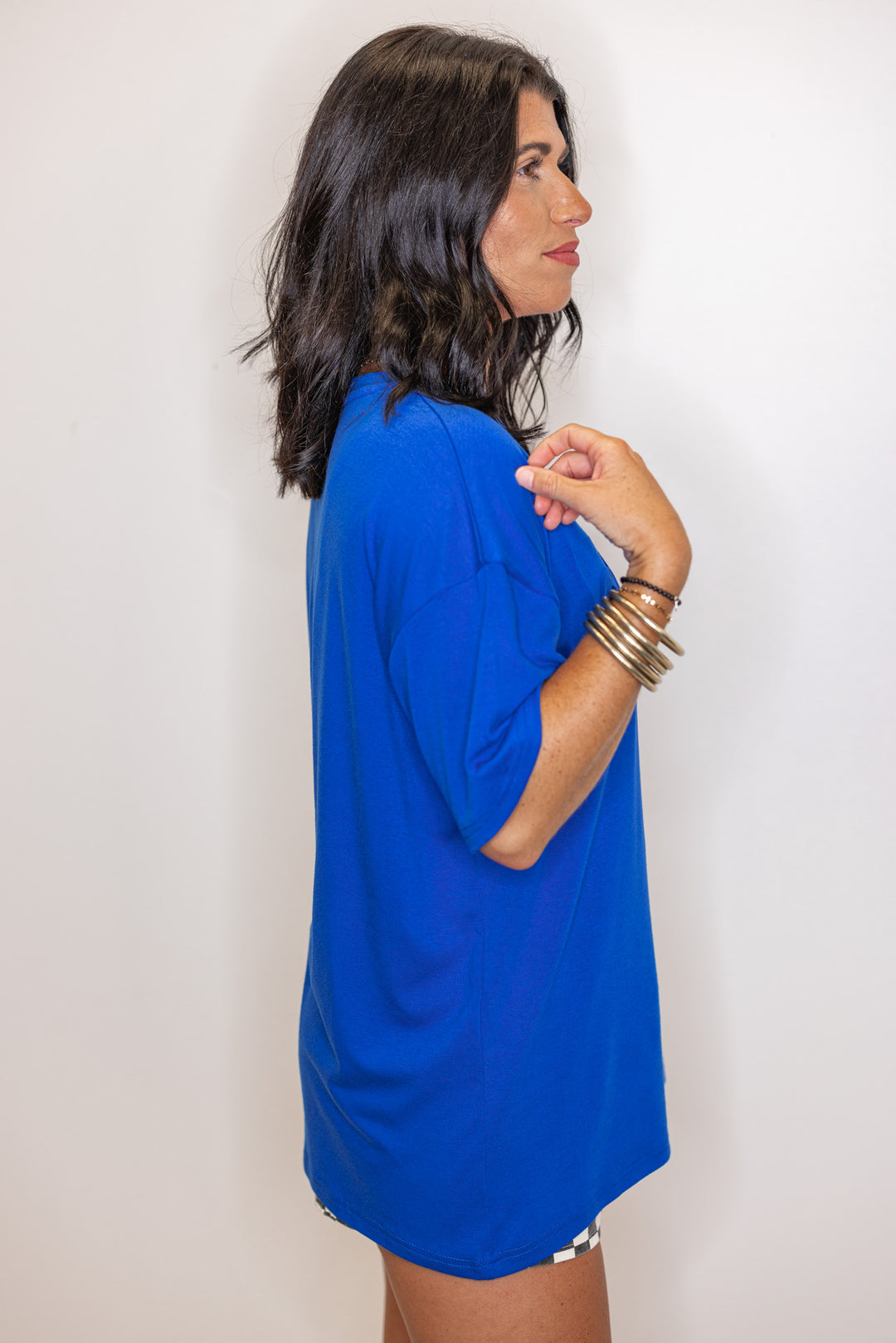 Women's royal blue lightweight top with embossed 'Go Team' in center by Jess Lea showing up close side view