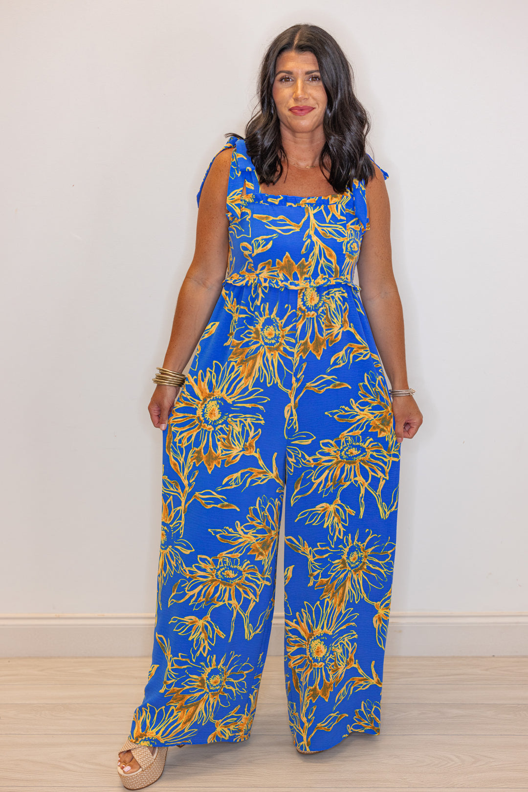 blue sunflower printed loose leg jumpsuit