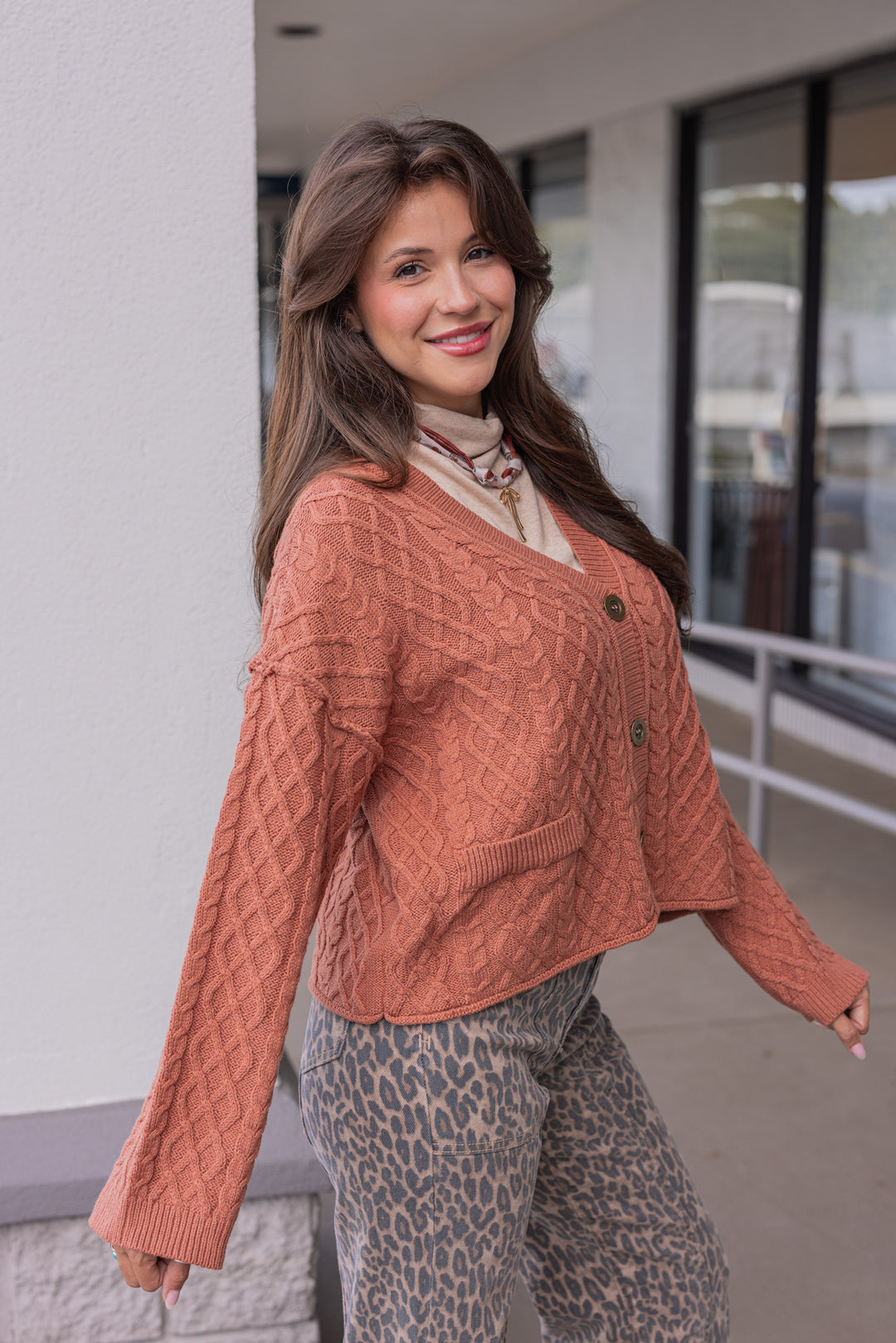 Women's terra cotta cable knit sweater cardigan by Entro showing side view