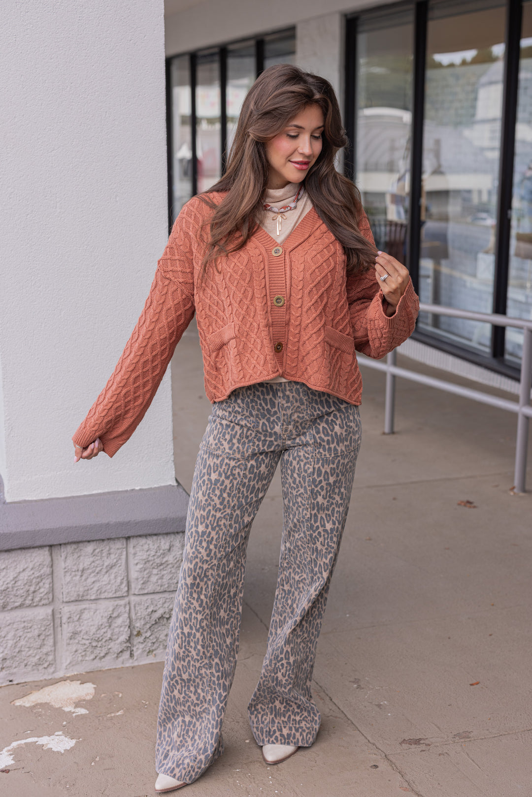 Women's terra cotta cable knit sweater cardigan by Entro showing full front view