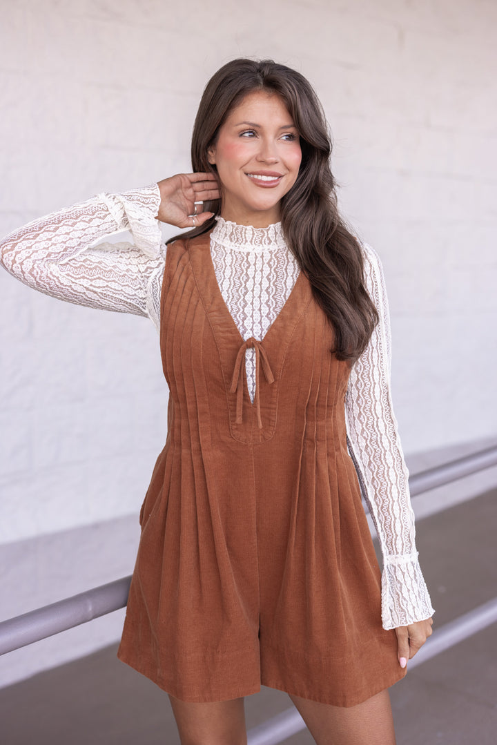 Women's caramel corduroy romper with ruched bodice and bow tie v neck by Wishlist showing front view